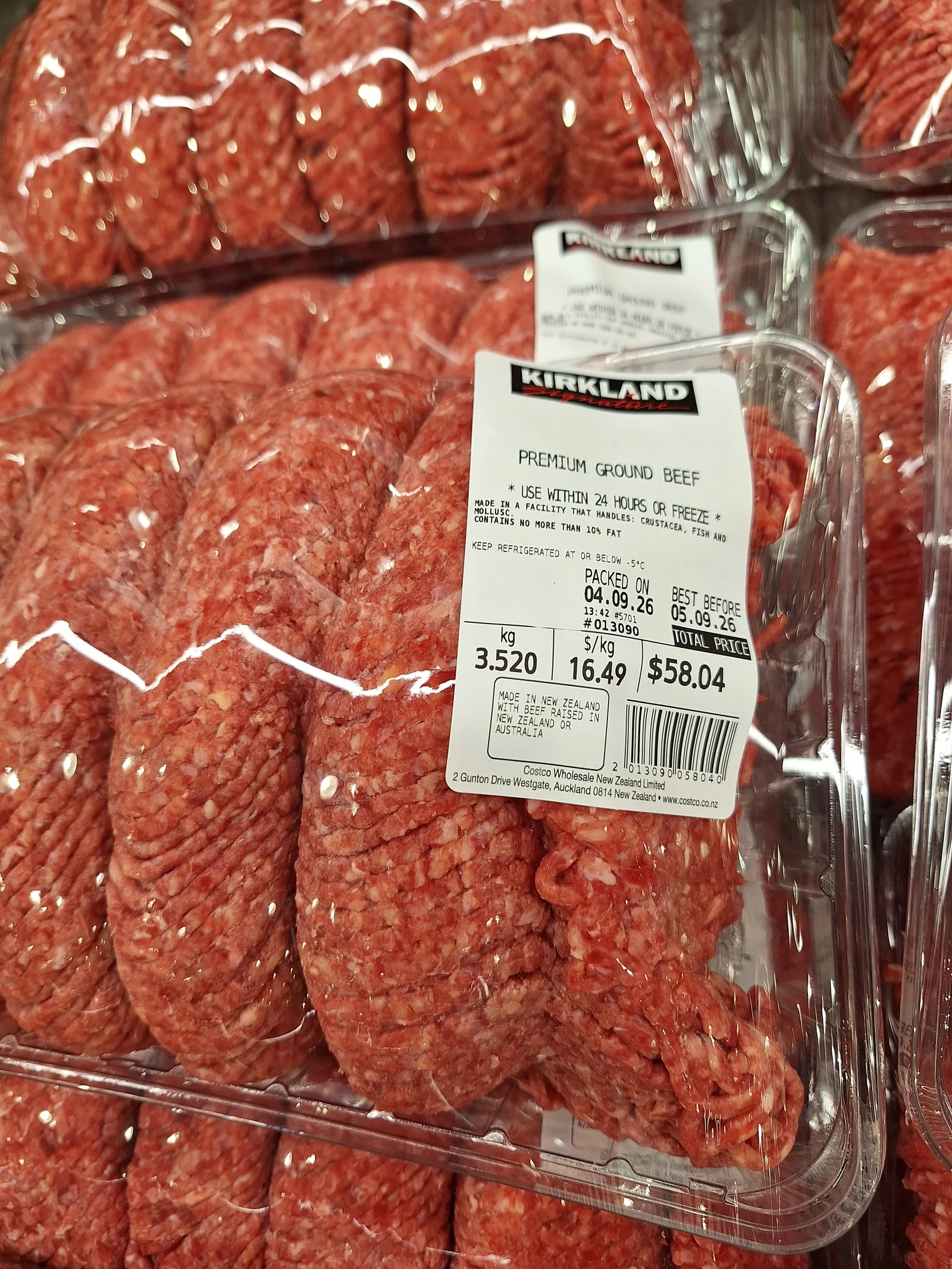 Close-up of a Costco Kirkland premium ground beef package showing a 3.520 kilogram pack priced at 58.04 dollars